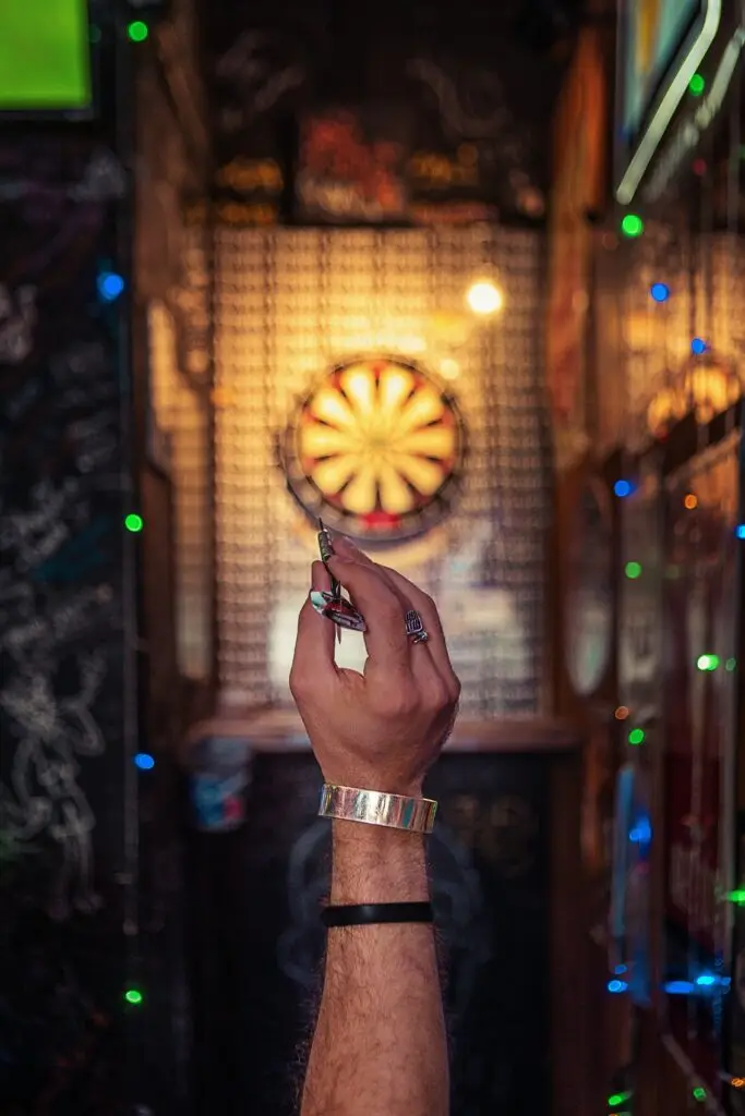 Dart player focusing on the target
