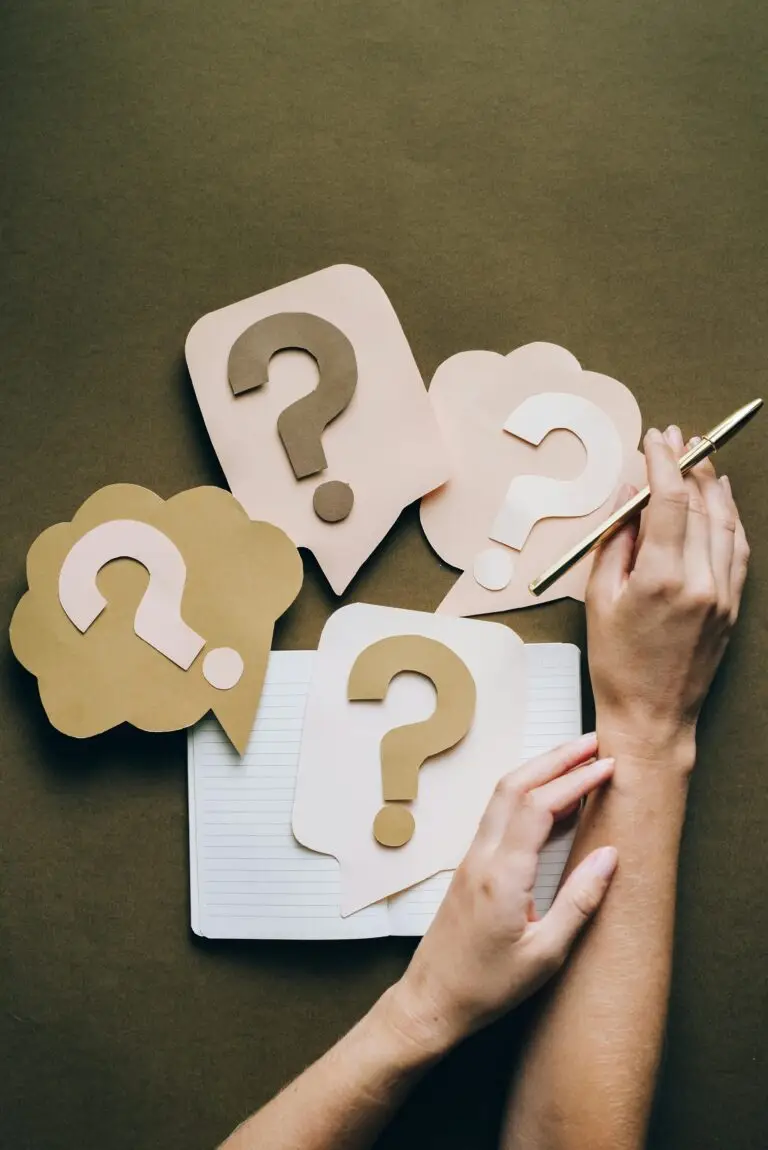 Leader writing and reflecting to overcome perfectionism and take action